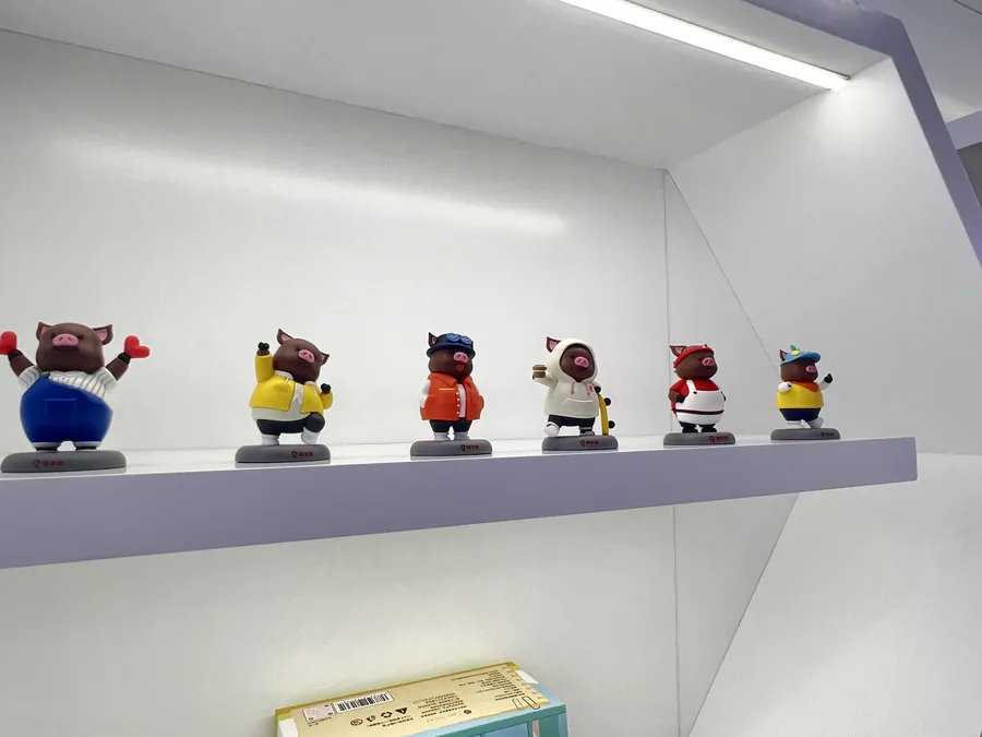 A coordinated series of custom mascot figures with different outfits and poses